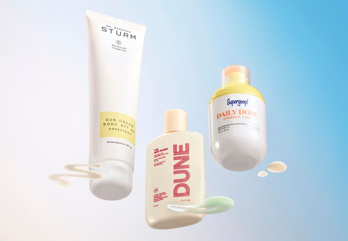 sunscreen bottles on colored background