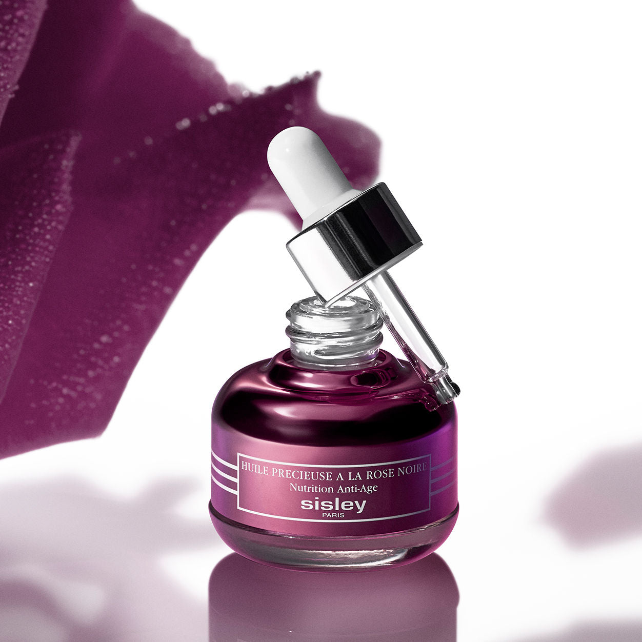 Image of an open Sisley Paris Black Rose Precious Face Oil