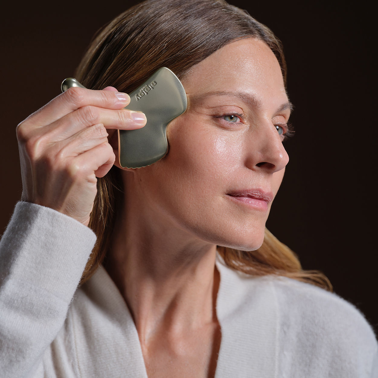 Model image of Sisley Paris Ginkgo Gua Sha Massage Tool