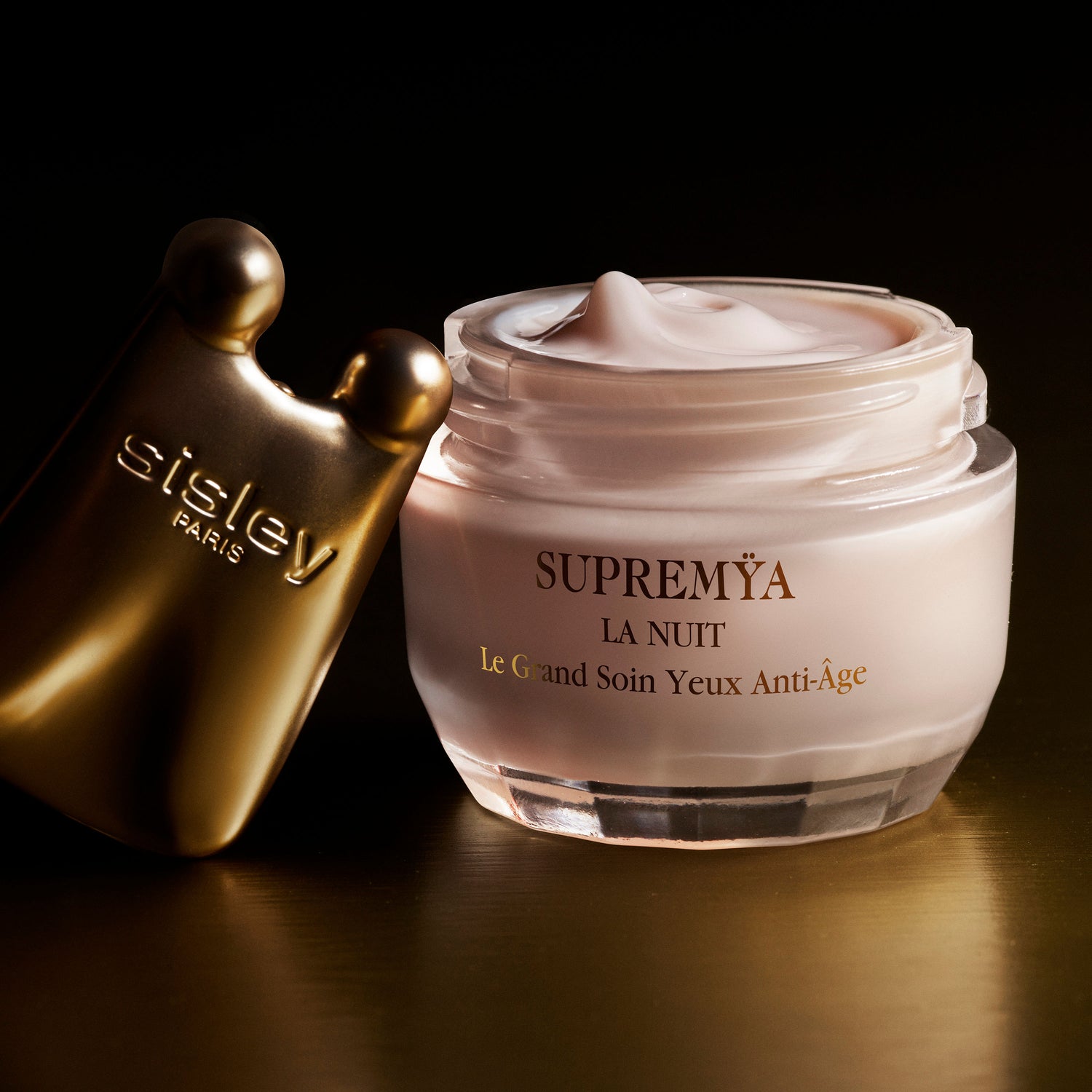 Image of an open Sisley Paris Supremÿa at Night The Supreme Anti-Aging Eye Cream