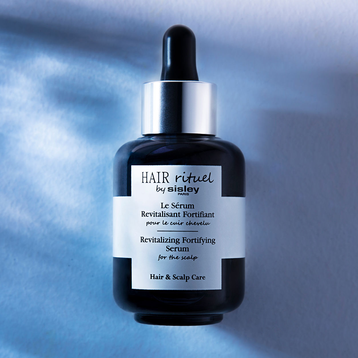 Lifestyle image of Sisley Paris Revitalizing Fortifying Serum for the Scalp