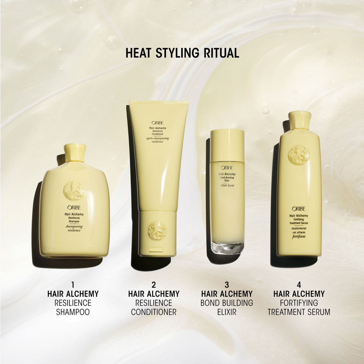 Four yellow bottles from the Oribe Hair Alchemy Strengthening Mini Travel Set—labeled as shampoo, conditioner, bond building elixir, and treatment serum for fragile hair—arranged in a row under the heading Heat Styling Ritual.