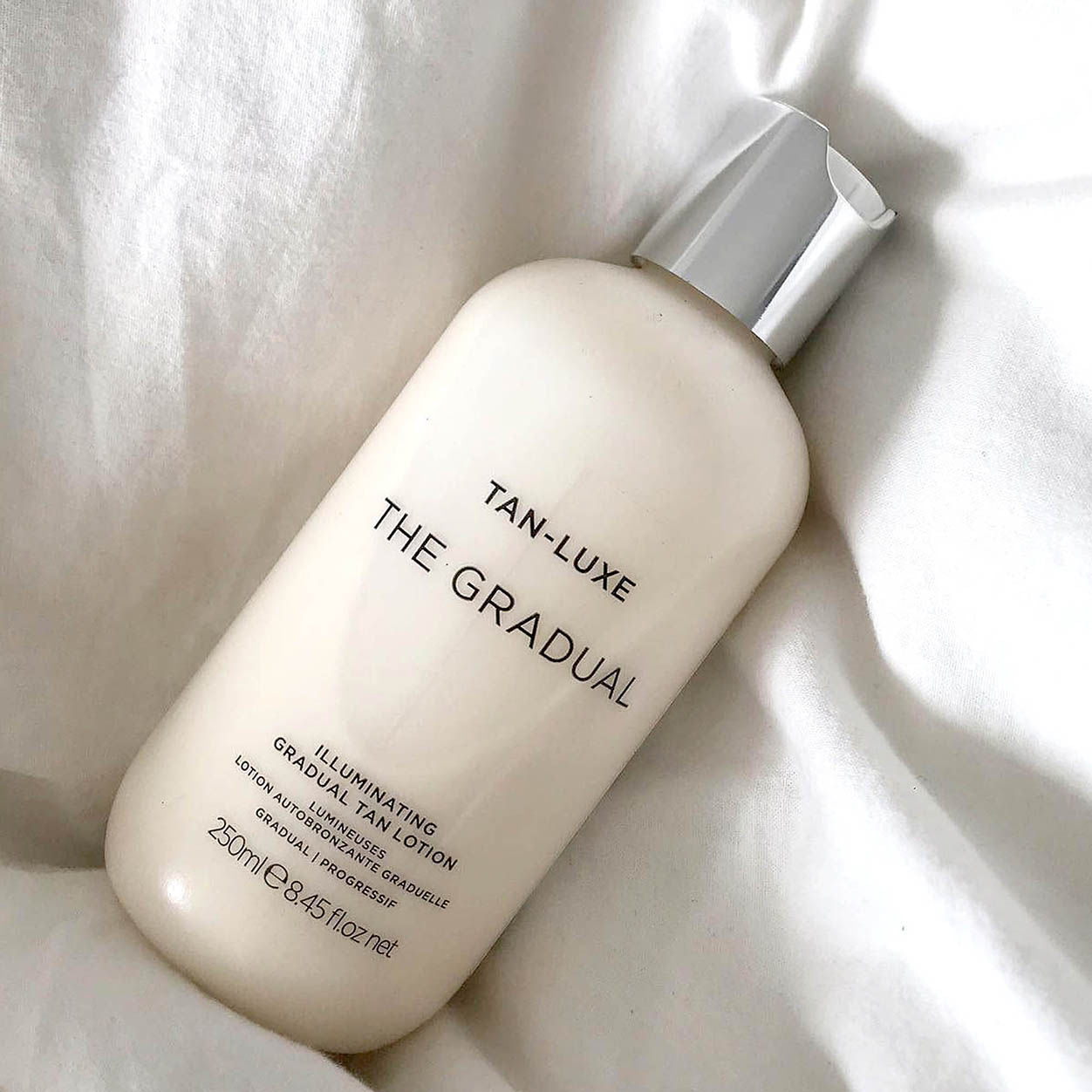 Lifestyle image of Tan-Luxe The Gradual Illuminating Tanning Lotion