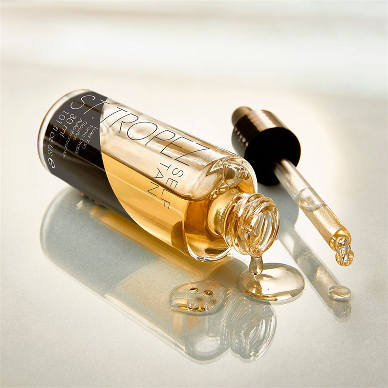 Lifestyle image of St. Tropez Luxe Tan Tonic Glow Drops