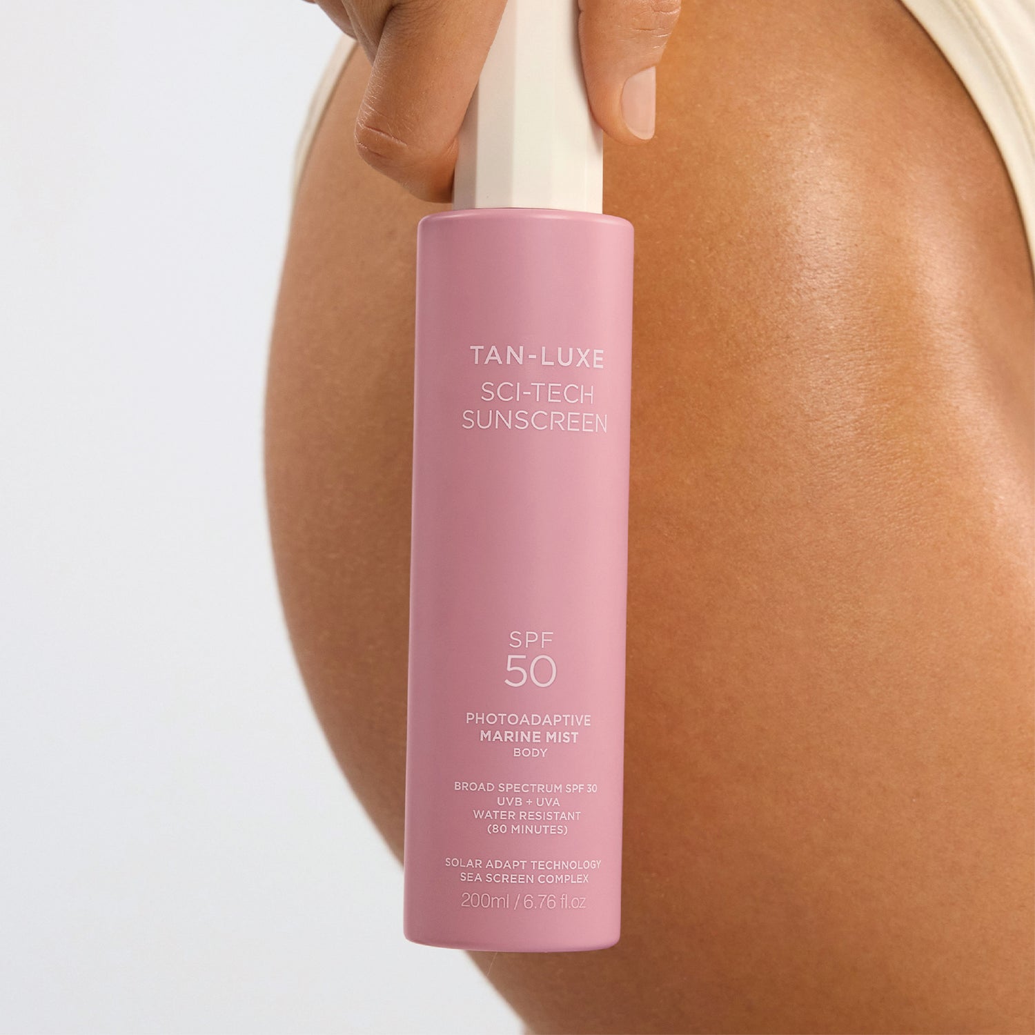 Lifestyle image of Tan-Luxe Sci-Tech Photoadaptive Marine Body Mist SPF 50