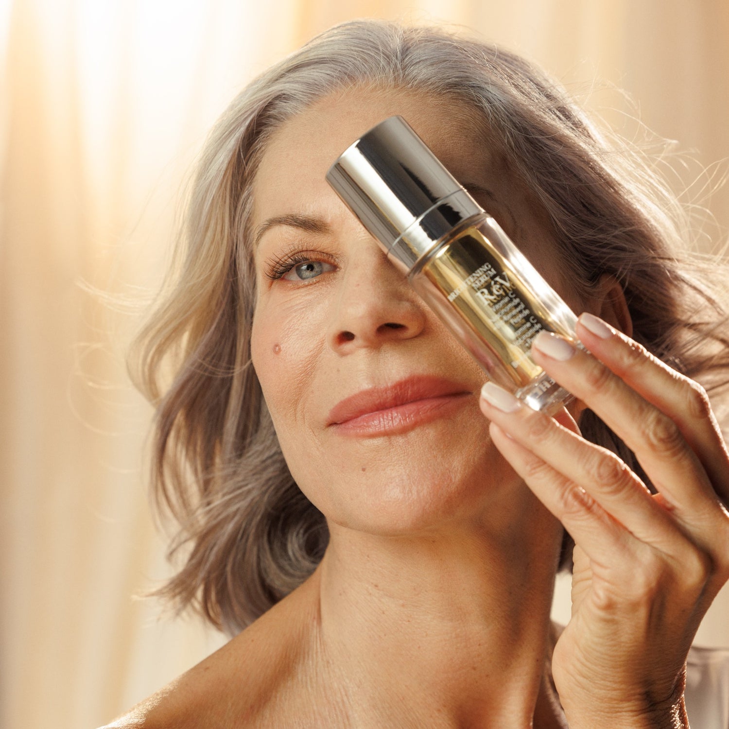 RéVive Brightening Serum model image .