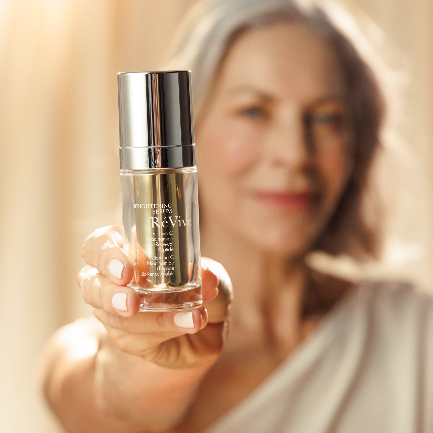RéVive Brightening Serum model image 2 .