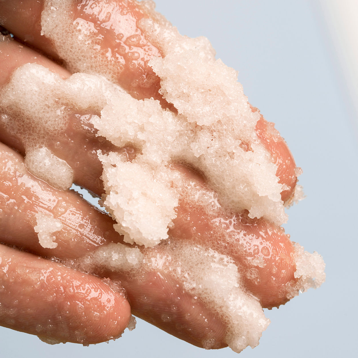Lifestyle image of Indie Lee Coconut Citrus Body Scrub