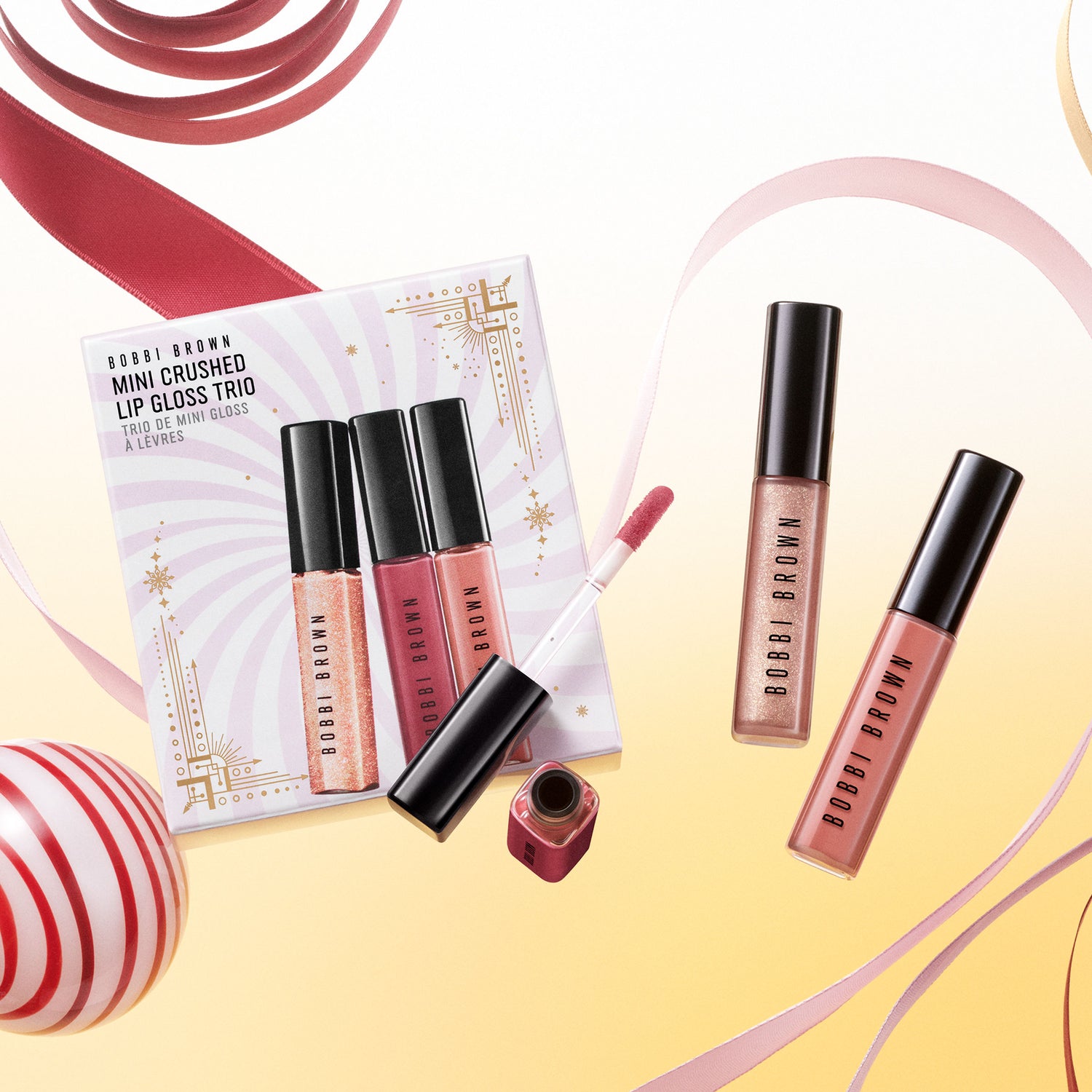 Lifestyle image of Bobbi Brown Mini Crushed Oil-Infused Lip Gloss Gift Set Trio (Limited Edition)