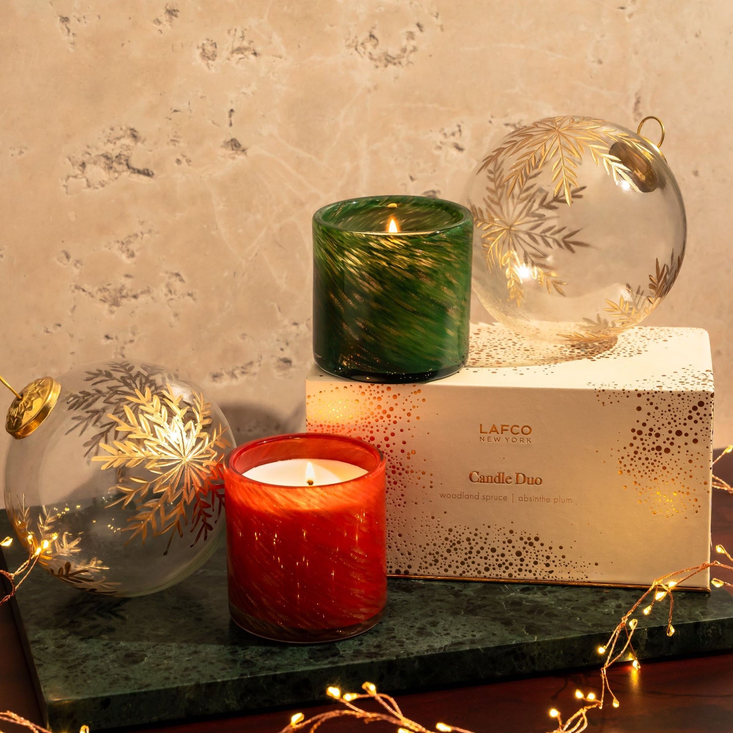Lifestyle image of Lafco Absinthe Plum and Woodland Spruce Candle Duo (Limited Edition)