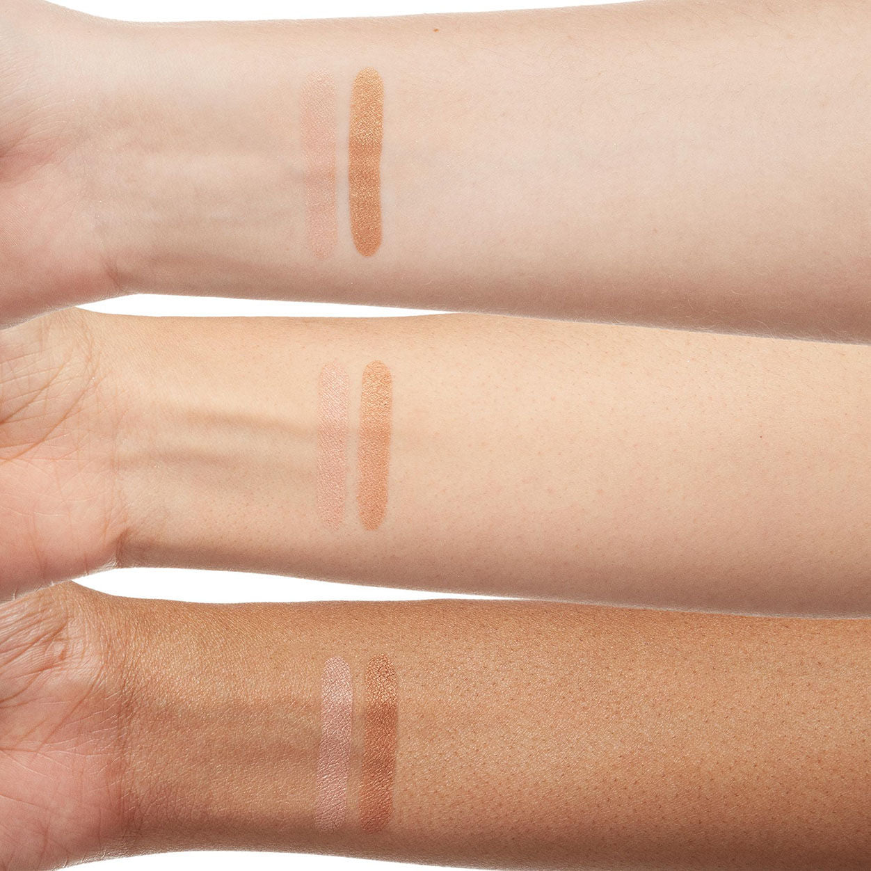 An arm swatch of Trish McEvoy Dual Resort Bronzer