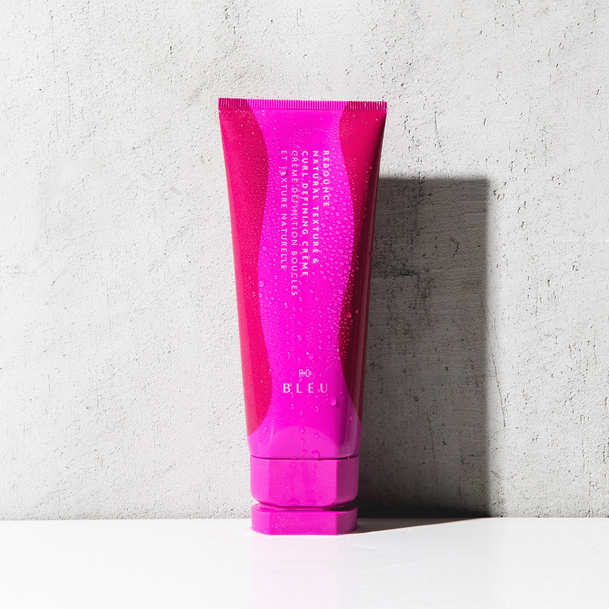 Lifestyle image of R+Co Bleu Rebounce Natural Texture and Curl Defining Creme