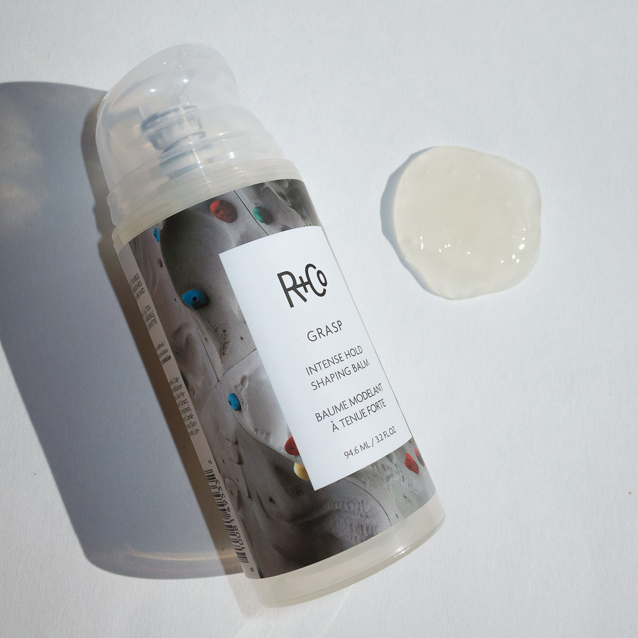 Lifestyle image of R+Co Grasp Intense Hold Shaping Balm