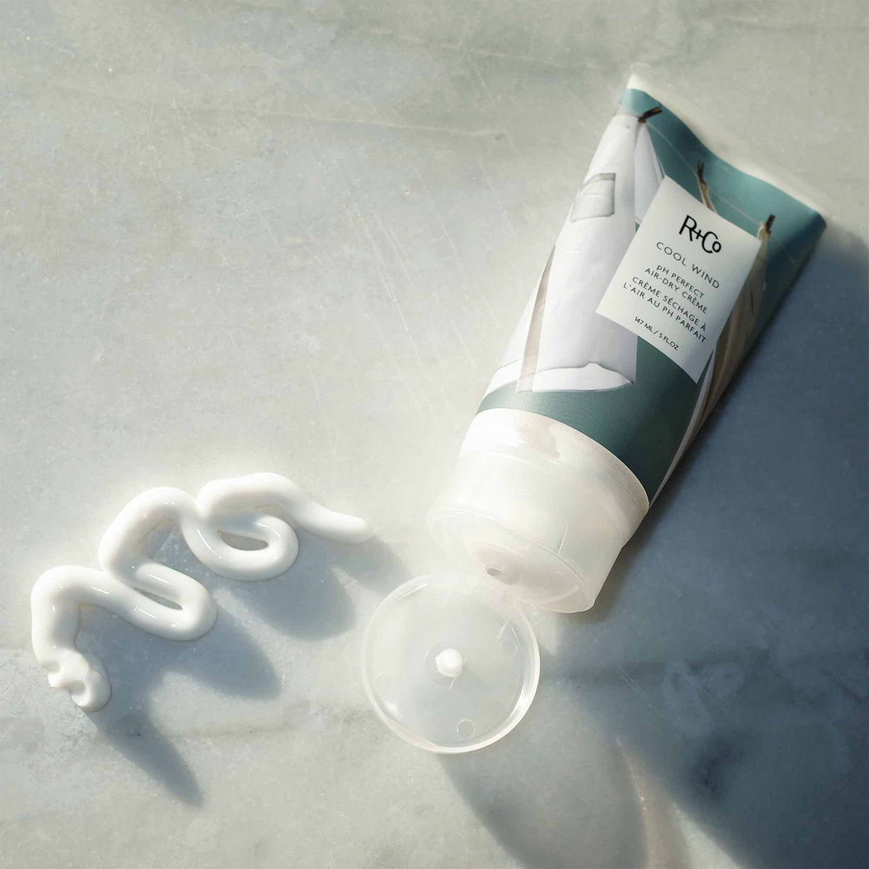 Lifestyle image of R+Co Cool Wind Air Dry Creme