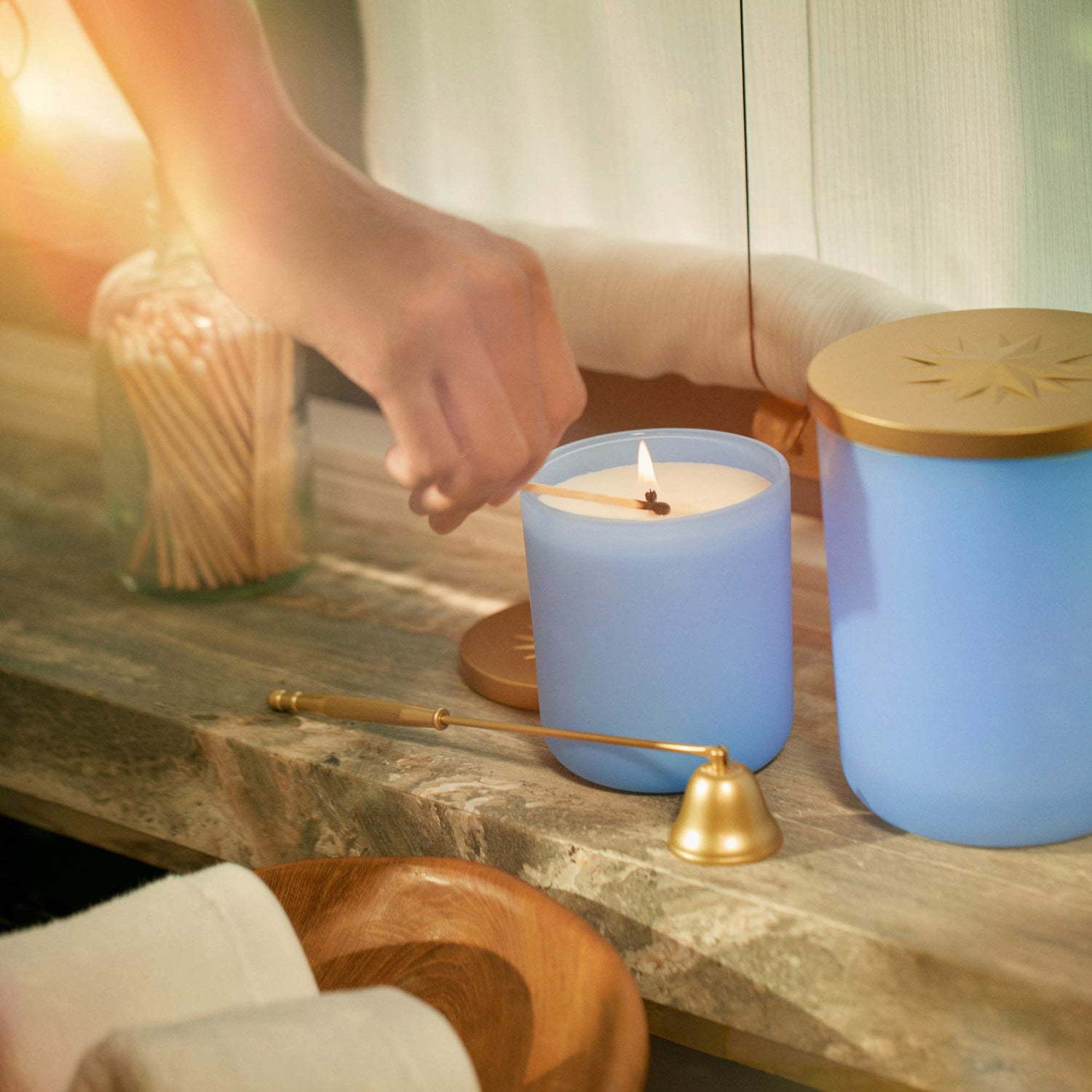 Lifestyle image of Cerulean 6 Candle Snuffer