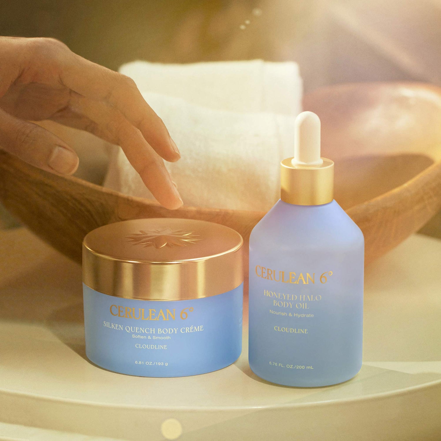 Lifestyle image of Cerulean 6 Honeyed Halo Body Oil in Cloudline