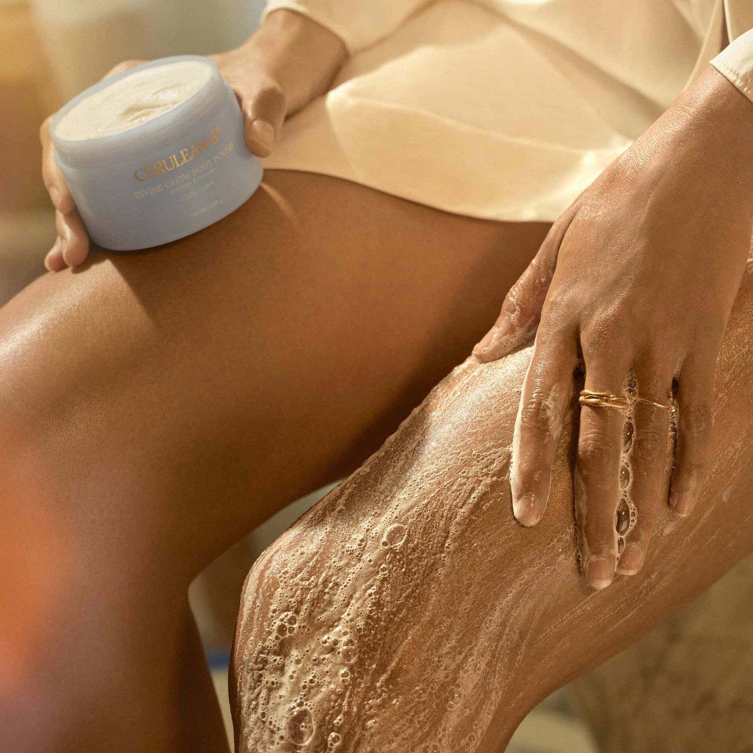 Model image of Cerulean 6 Divine Glow Body Polish in Cloudline
