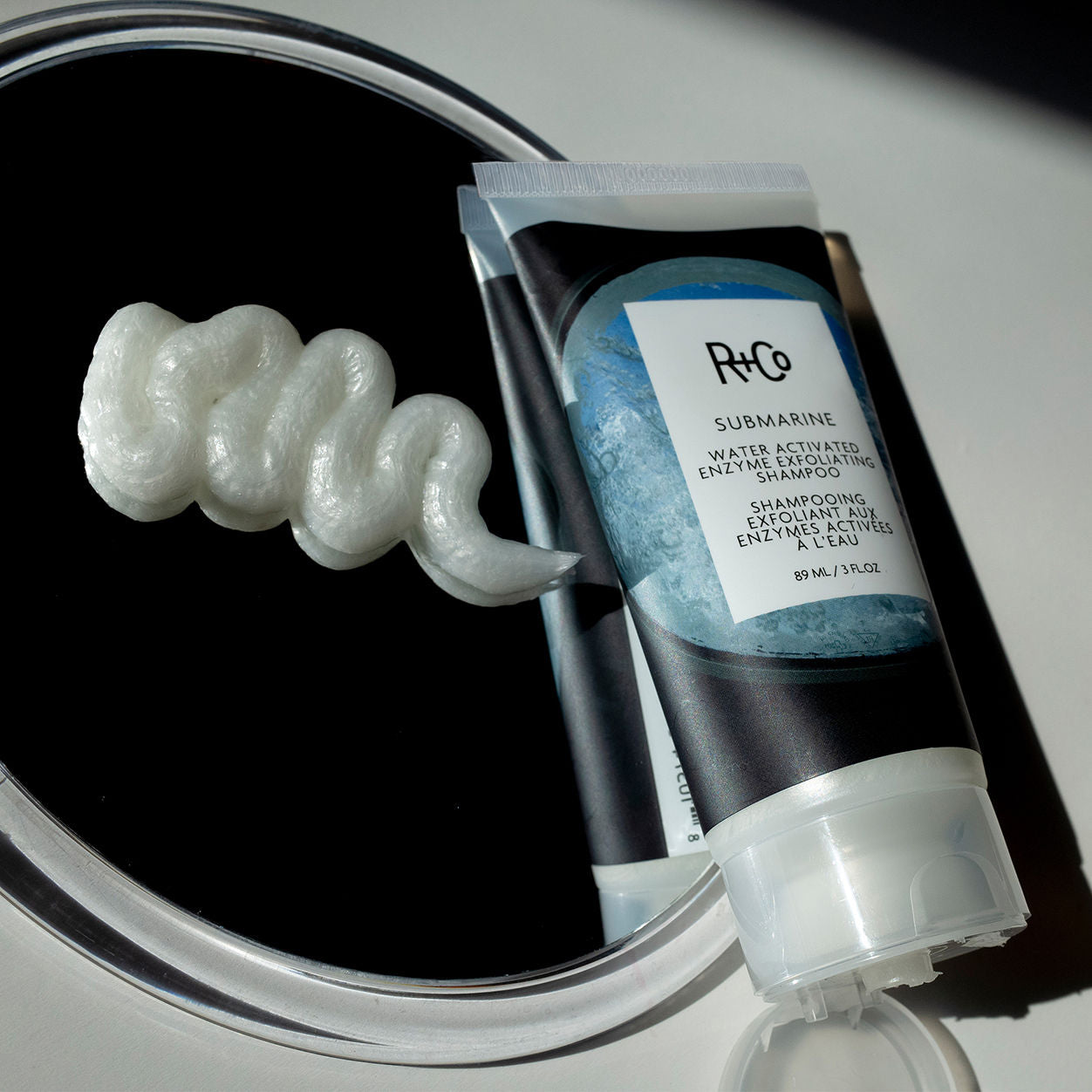 Lifestyle image of R+Co Submarine Water Activated Exfoliating Shampoo