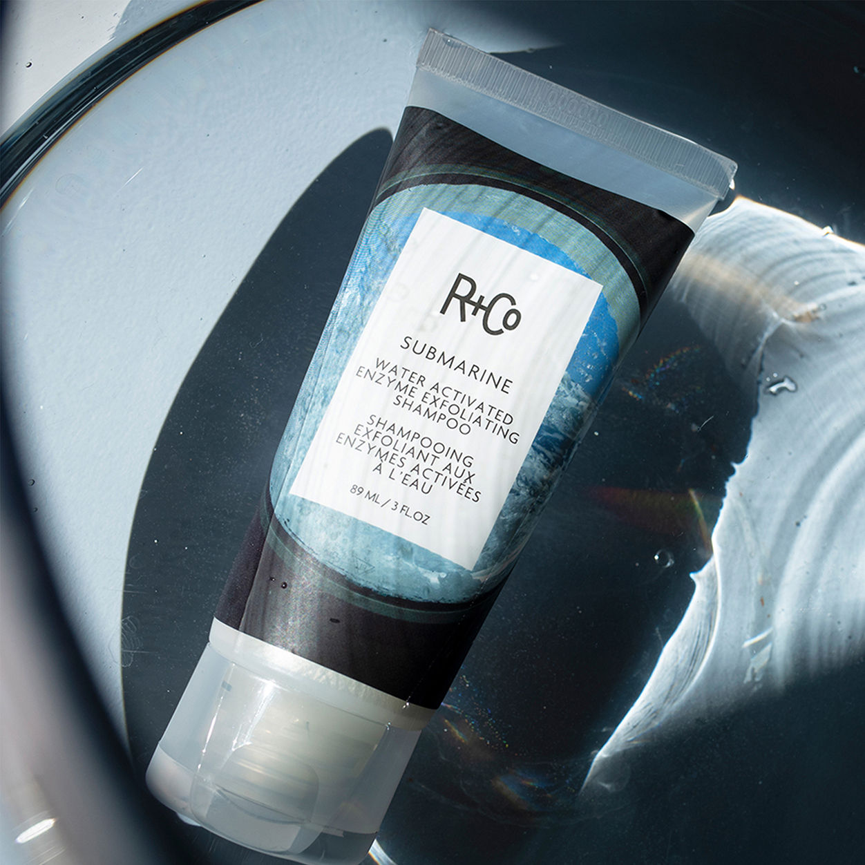 Lifestyle image of R+Co Submarine Water Activated Exfoliating Shampoo