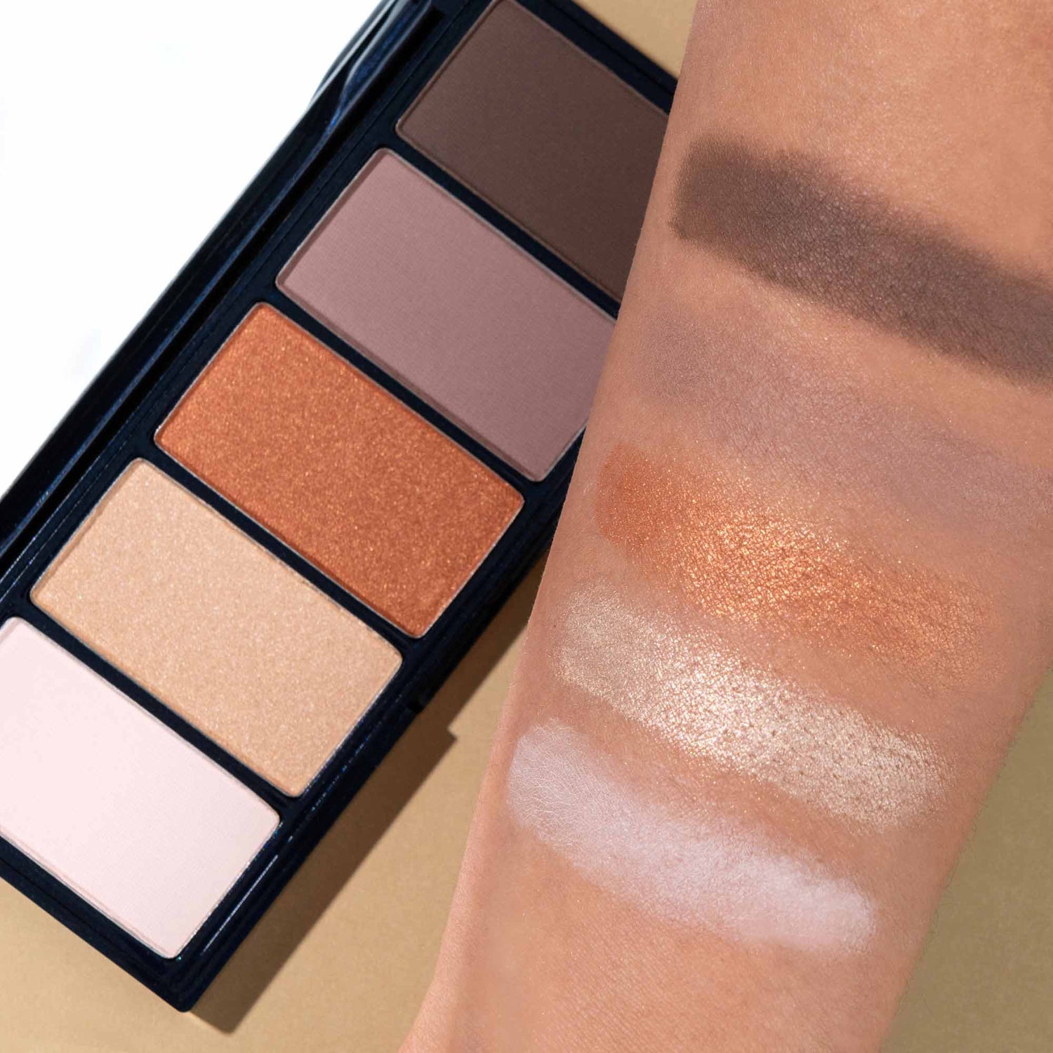 An arm swatch of Lune+Aster Moonrise Eyeshadow Palette