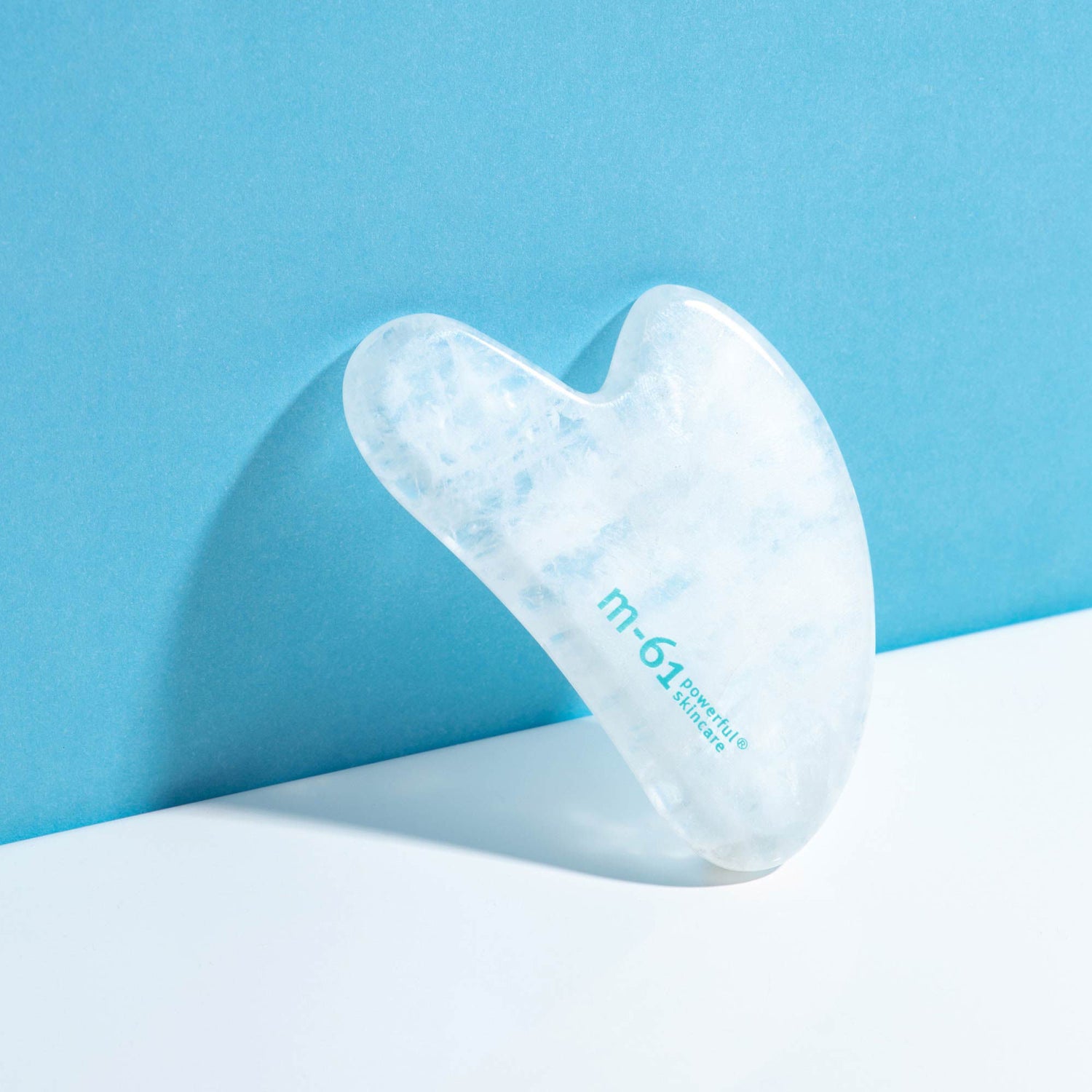 Lifestyle image of M-61 Clear Quartz Gua Sha