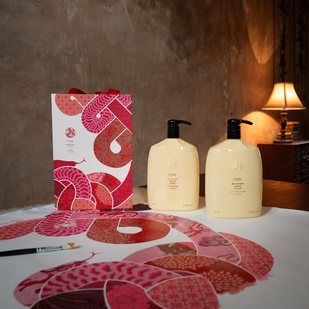 Lifestyle image of Oribe Lunar New Year Hair Alchemy Liter Set (Limited Edition)