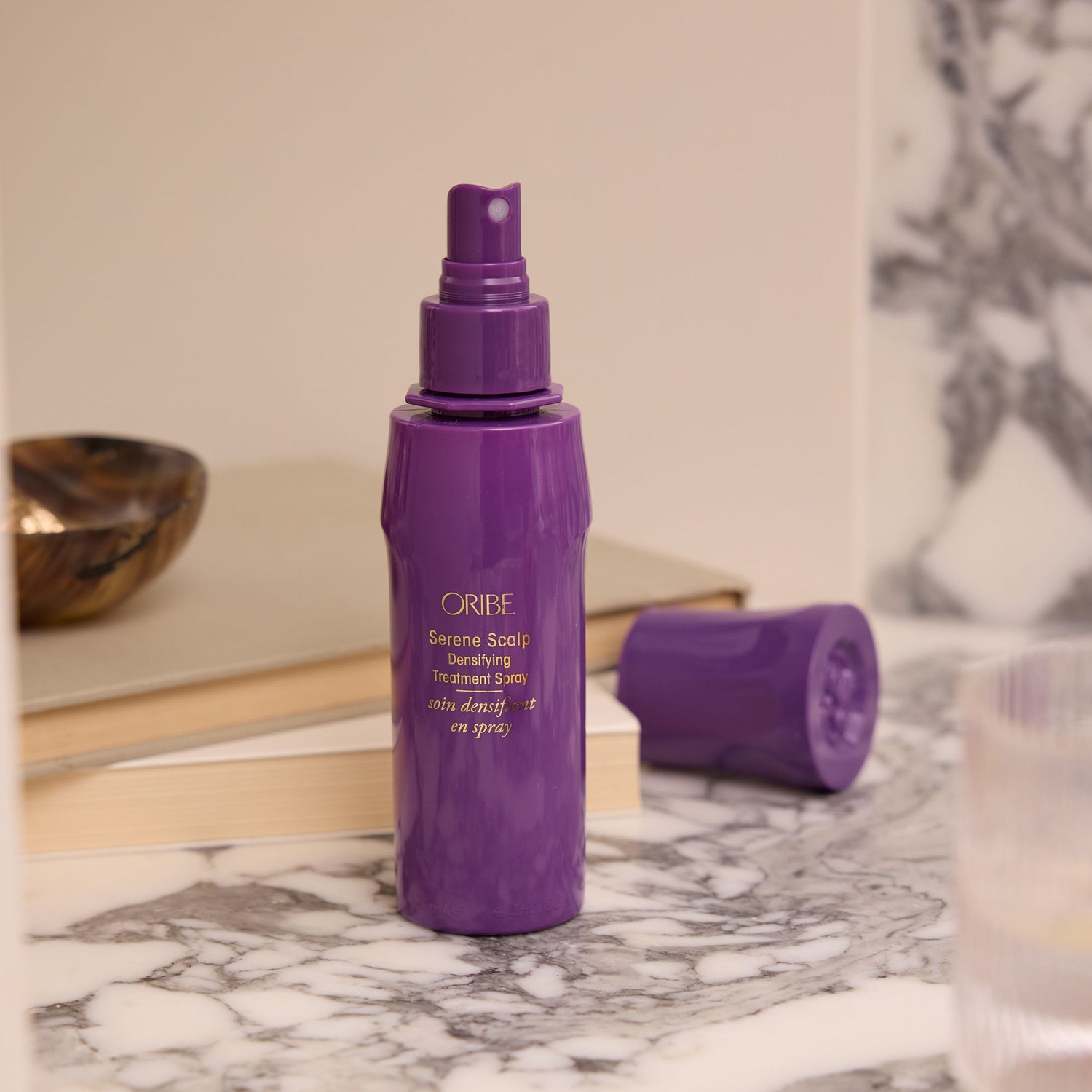 Lifestyle image of Oribe Serene Scalp Densifying Treatment Spray