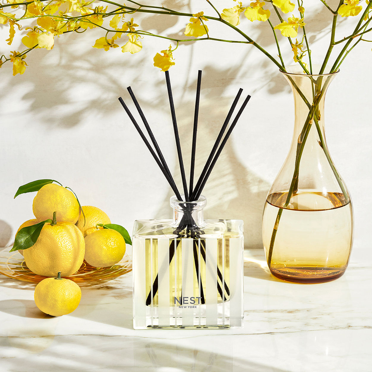 Lifestyle image of Nest Sunlit Yuzu and Neroli Reed Diffuser
