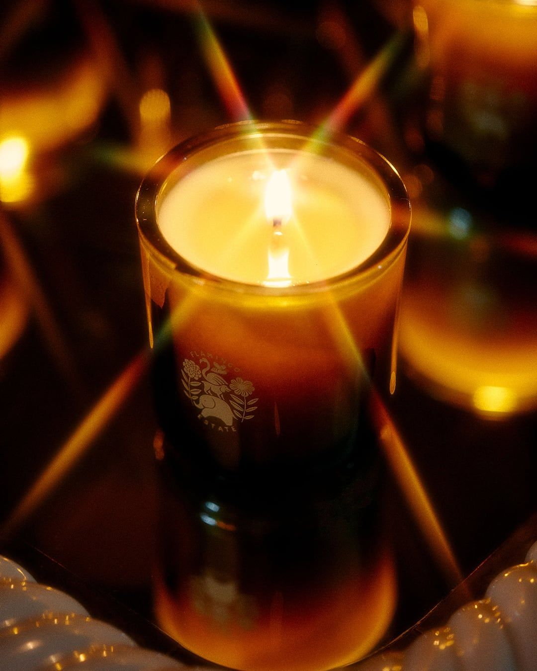 Lifestyle image of Flamingo Estate Climbing Tuscan Rosemary Candle