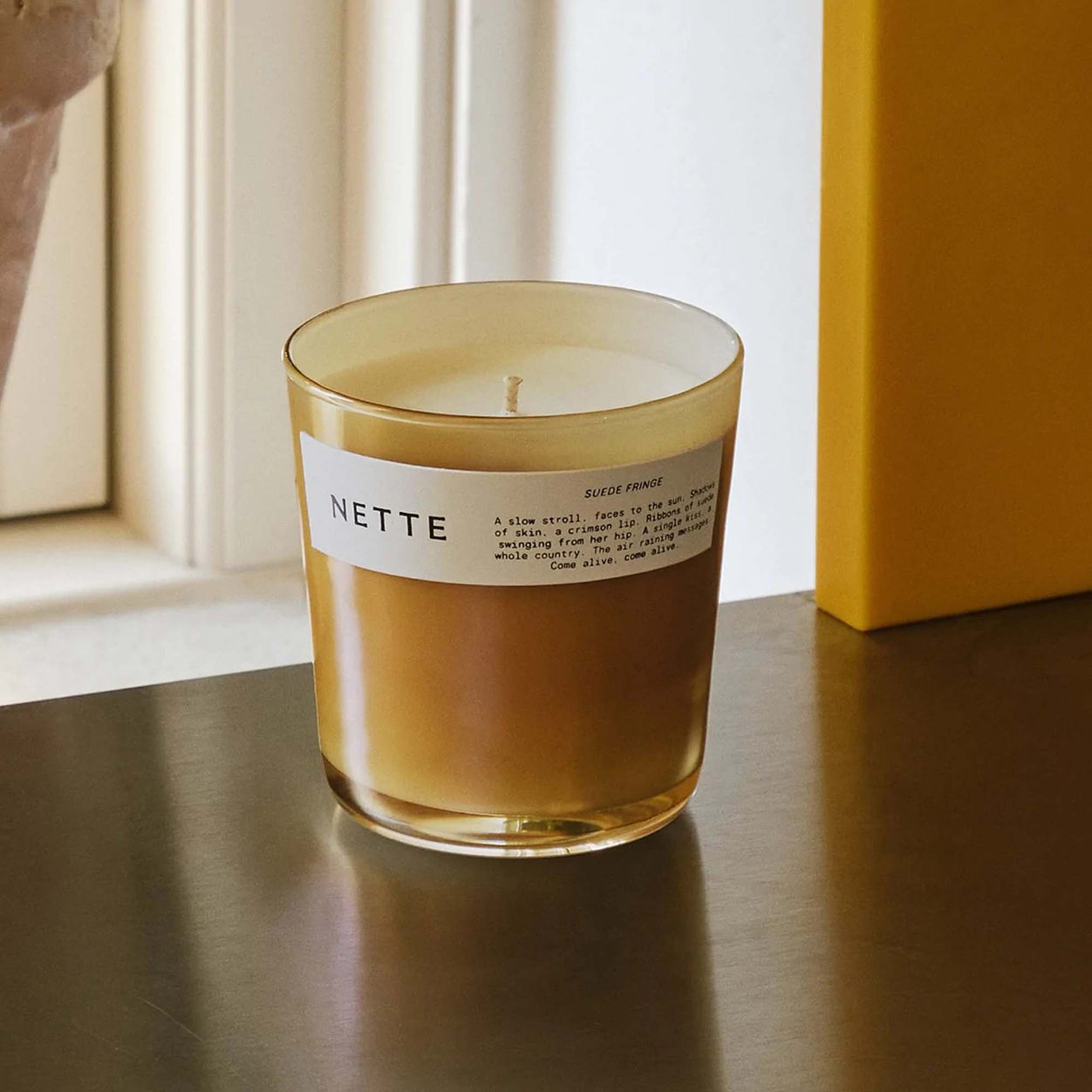 Lifestyle image of Nette Suede Fringe Candle