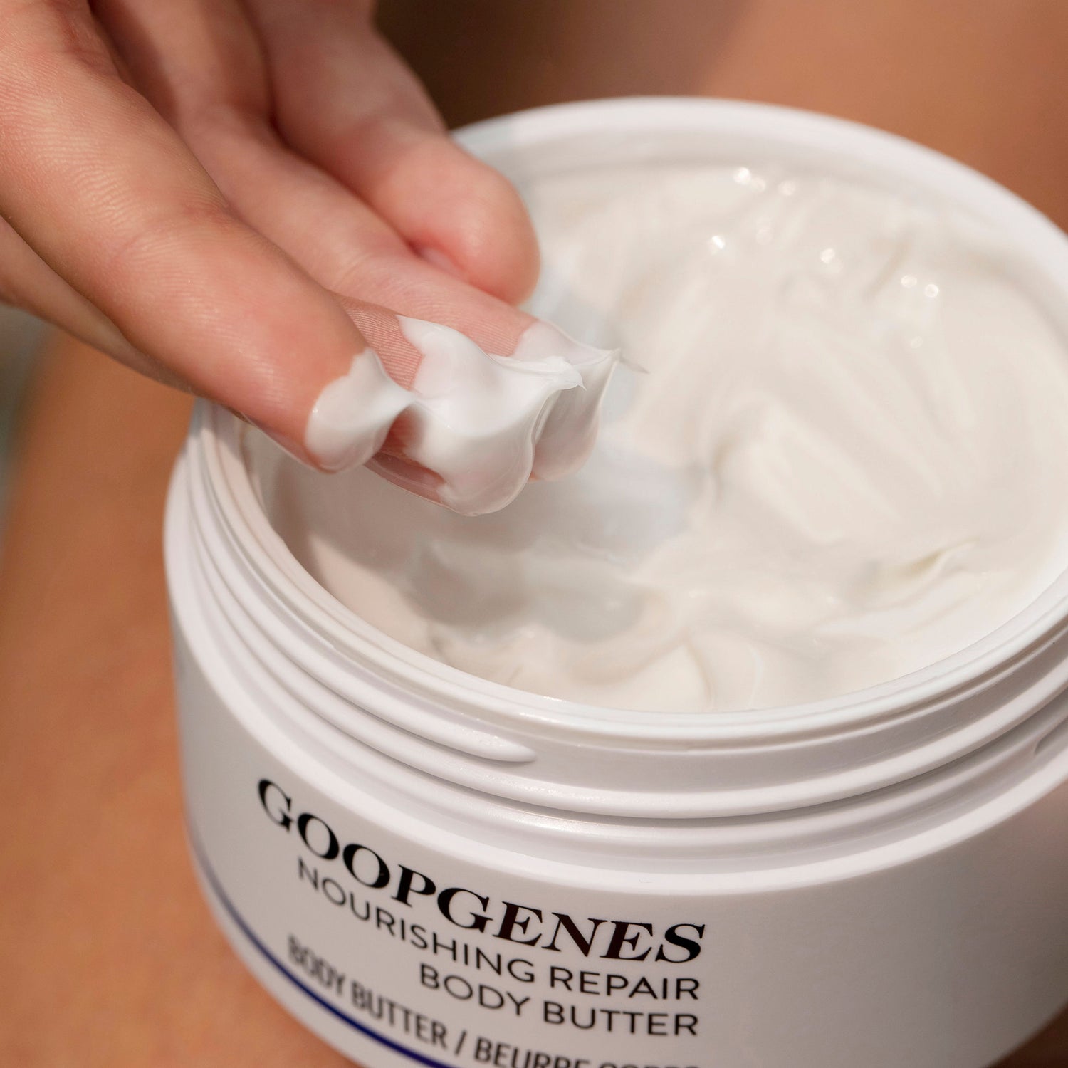 Image of an open Goop Nourishing Repair Body Butter
