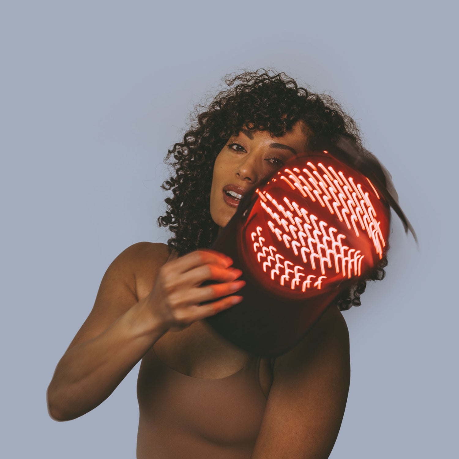 Lifestyle image of HigherDose Red Light Hat