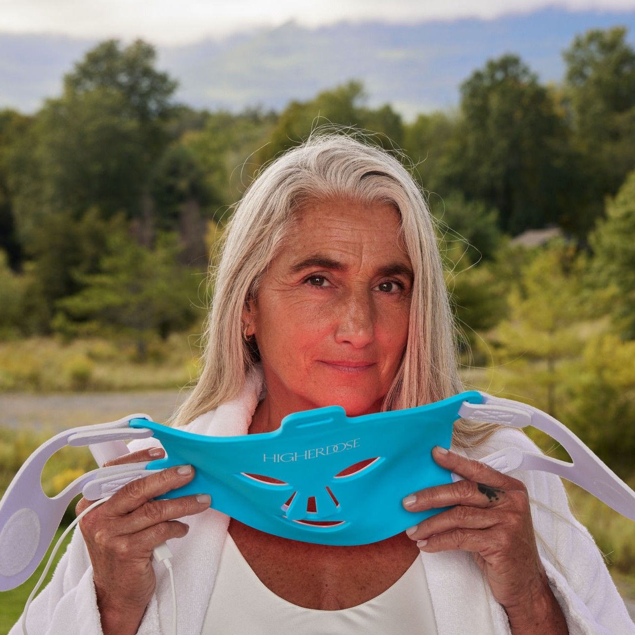 Lifestyle image of HigherDose Red Light Face Mask