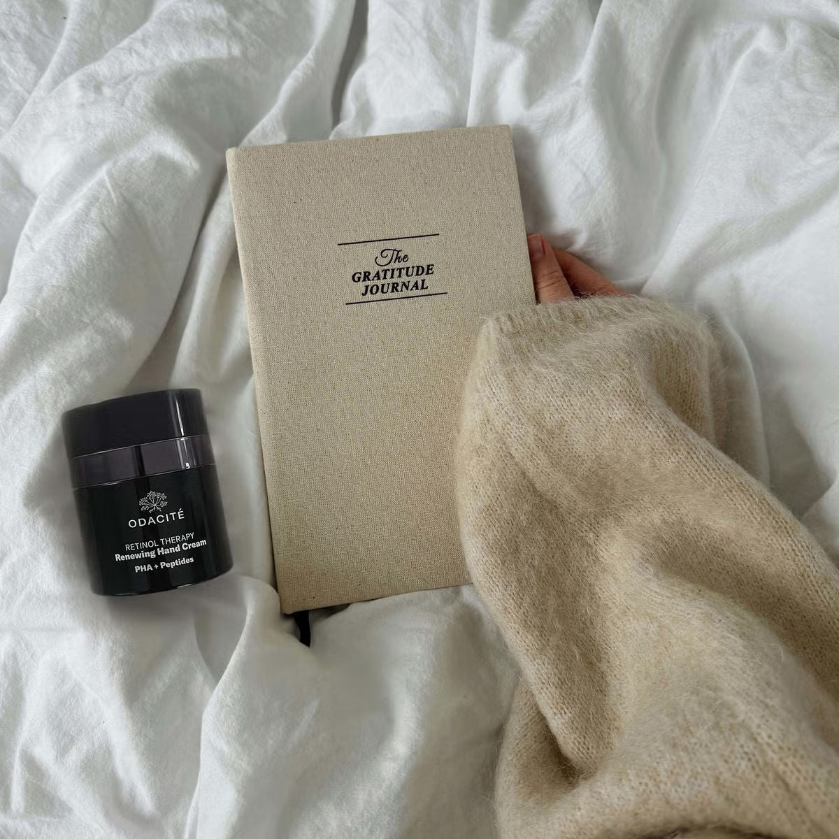 Lifestyle image of Odacité Retinol Therapy Renewing Hand Cream