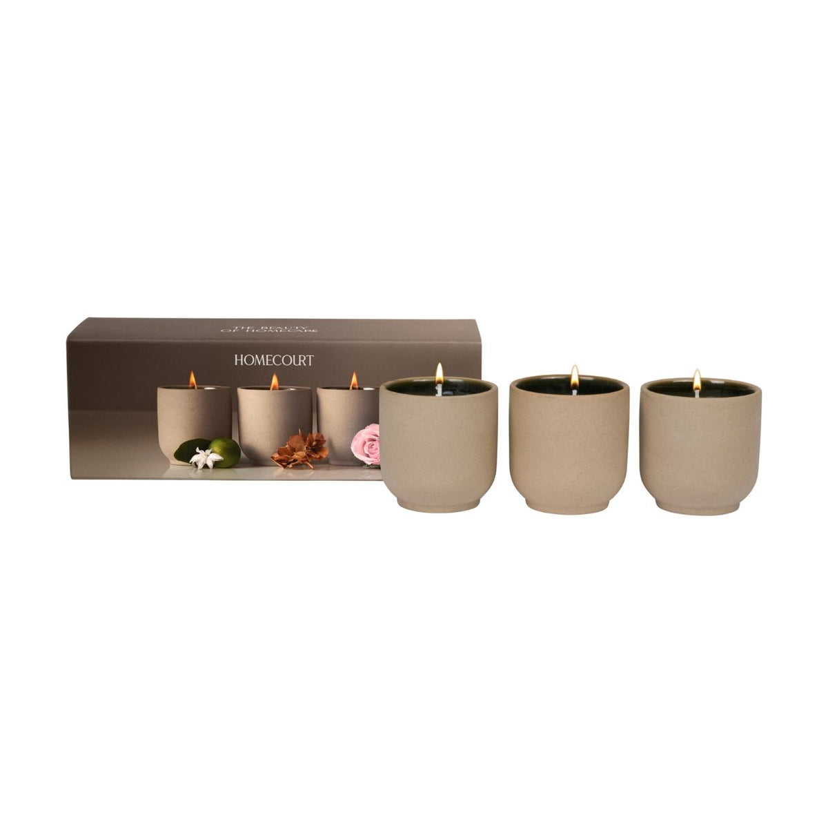 Three clean-burning votives in matte tan jars from the Candle Discovery Set (Limited Edition) next to their rectangular gift box.