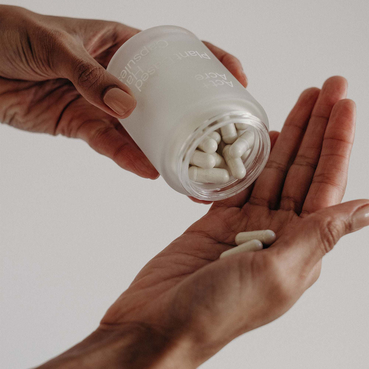 Model image of Act+Acre Cold Processed Plant Based Hair Capsules
