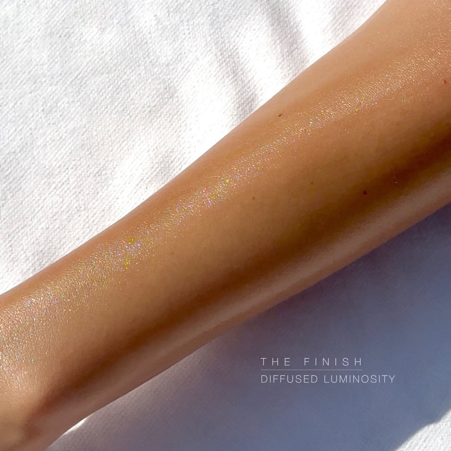 An arm swatch of Hampton Sun Sun Glow Luminous Body Oil SPF 50