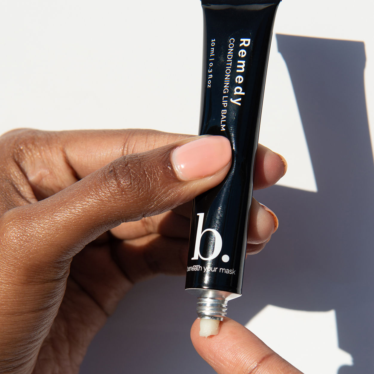 Lifestyle image of Beneath Your Mask Remedy Conditioning Lip Balm