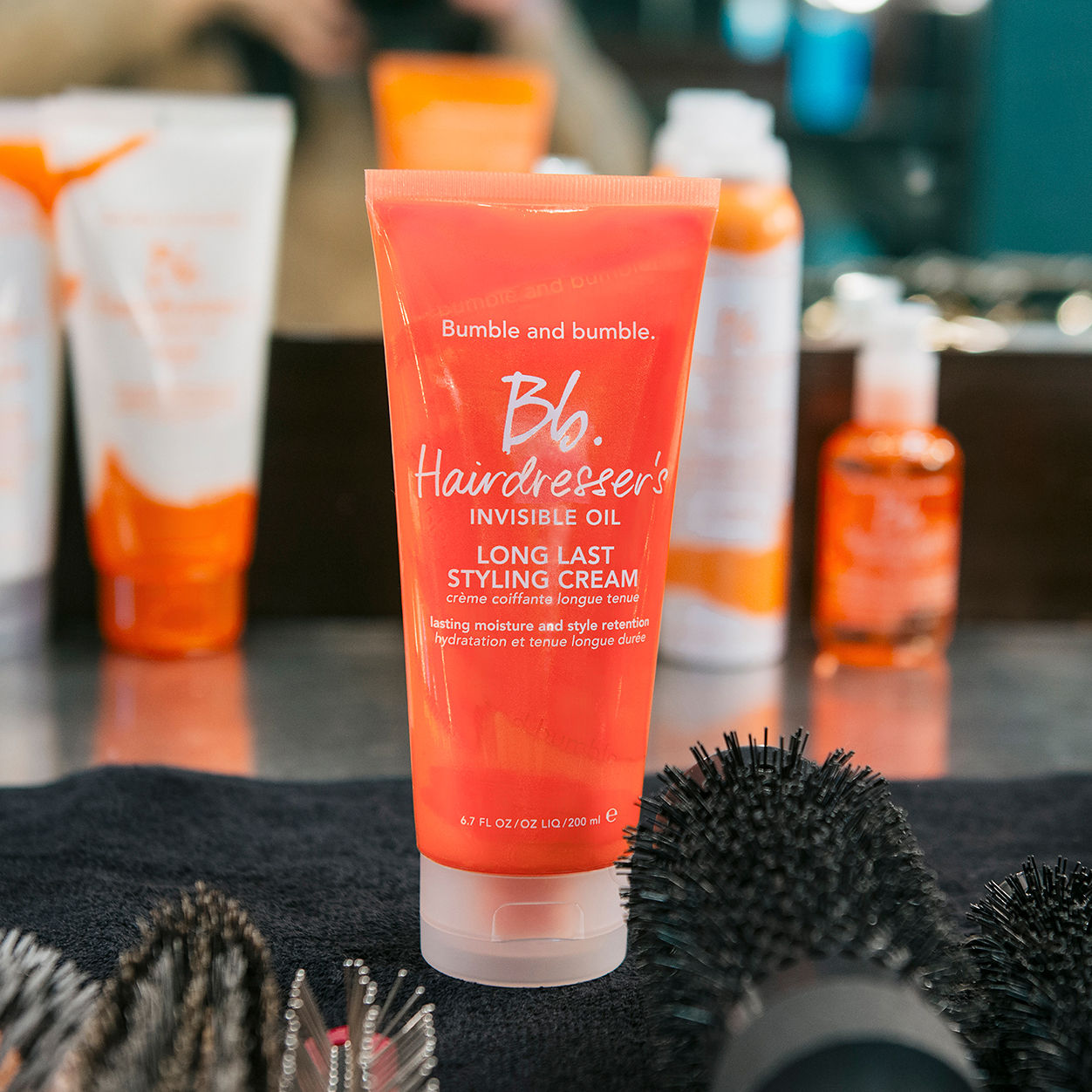 Lifestyle image of Bumble and Bumble Hairdresser's Invisible Oil Long Last Hydrating Hair Styling Cream variant: 6.7 fl oz