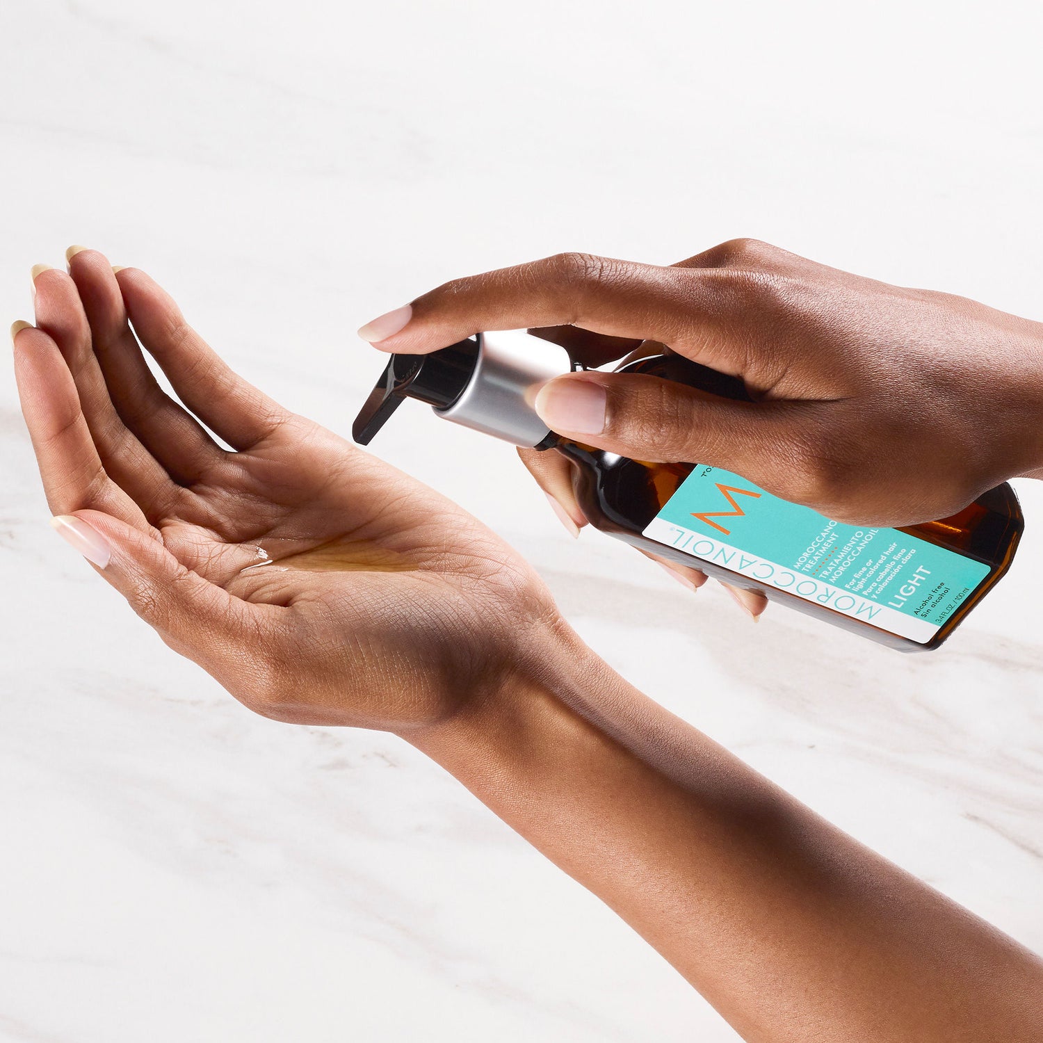 Model image of Moroccanoil Moroccanoil Treatment Light variant: 0.85 fl oz