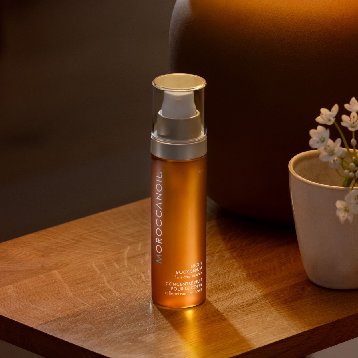 Lifestyle image of Moroccanoil Night Body Serum variant: 3.4 fl oz
