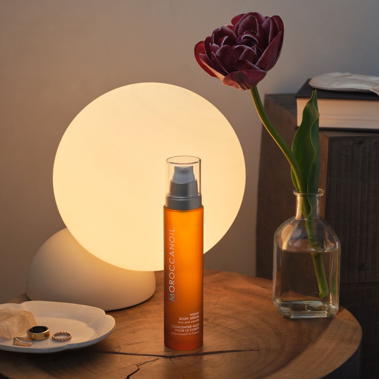 Lifestyle image of Moroccanoil Night Body Serum variant: 3.4 fl oz