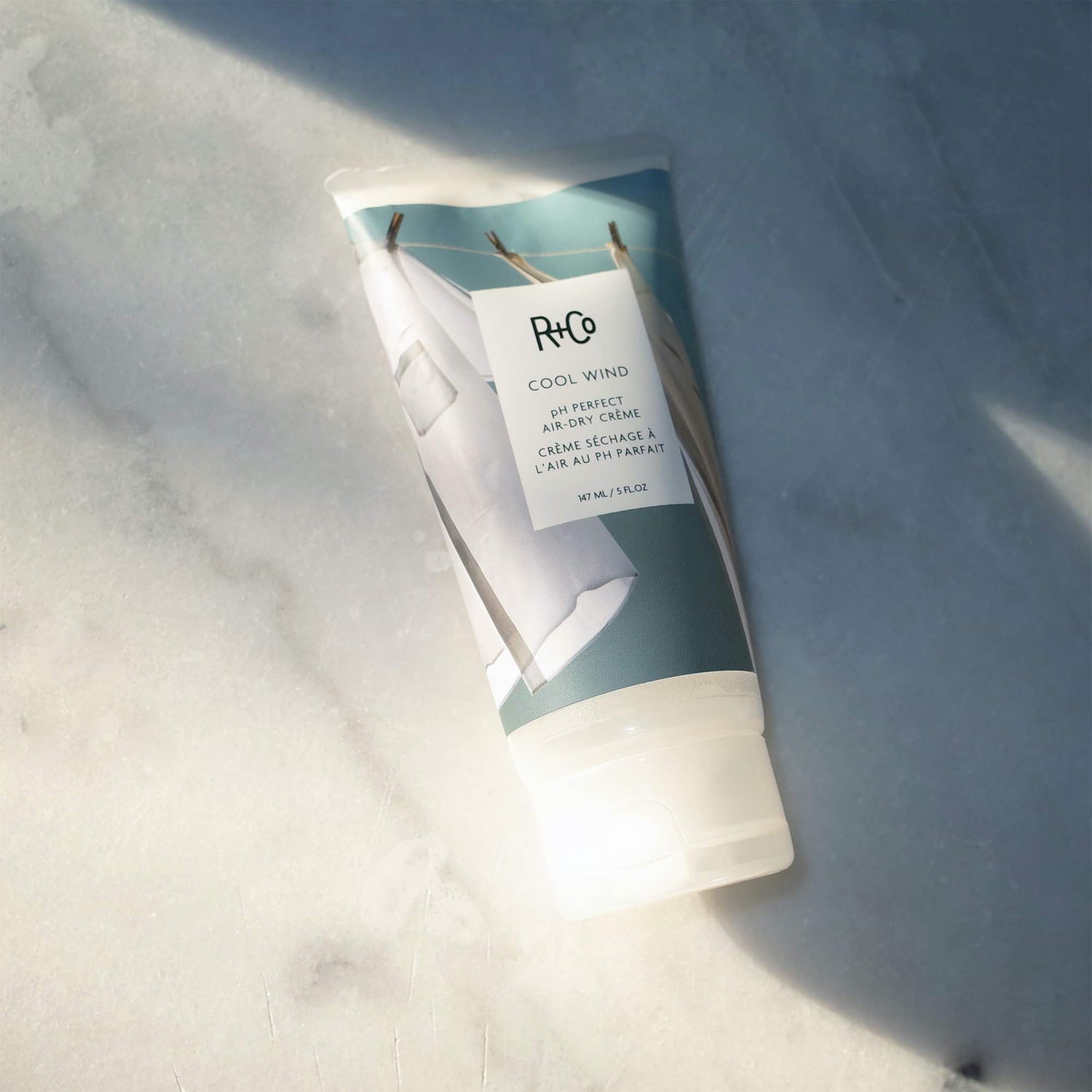 Lifestyle image of R+Co Cool Wind PH Perfect Air Dry Crème