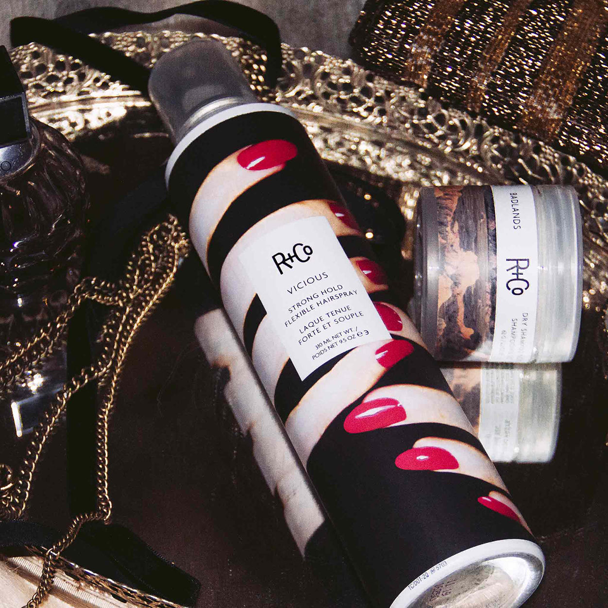 Lifestyle image of R+Co Vicious Strong Hold Flexible Hairspray variant: 2 fl oz