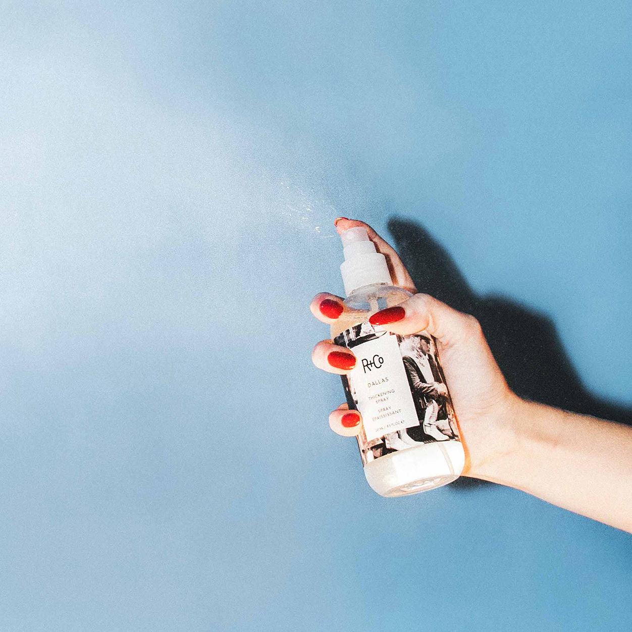 Lifestyle image of R+Co Dallas Thickening Spray variant: 8.5 fl oz