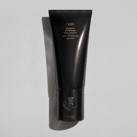 Lifestyle image of Oribe Signature Conditioner variant: 6.8 oz