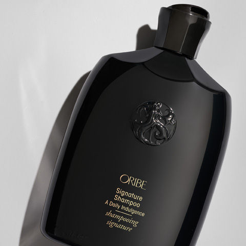 Lifestyle image of Oribe Signature Shampoo variant: 8.5 oz