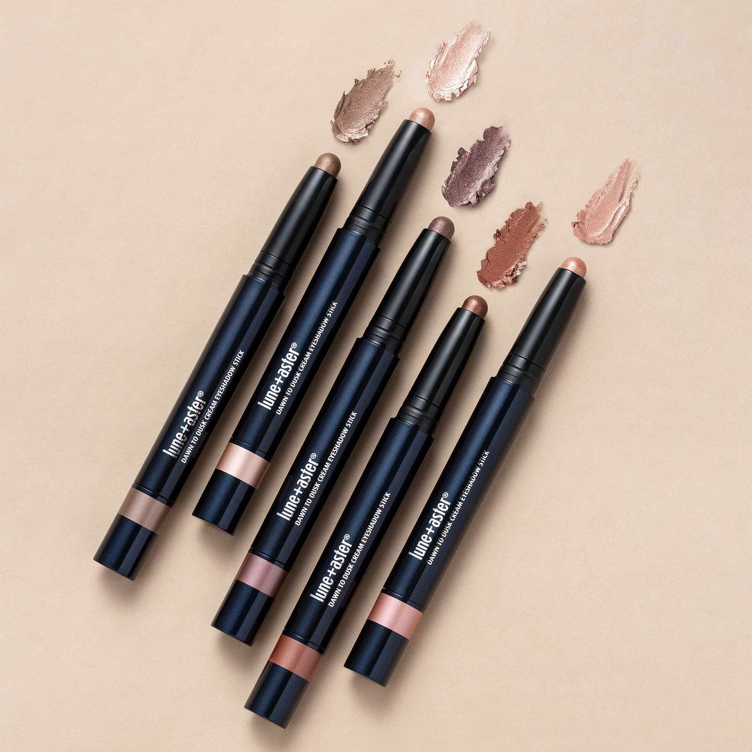 Lifestyle image of Lune+Aster Dawn to Dusk Cream Eyeshadow Stick variant: Shimmer Frosted Blush
