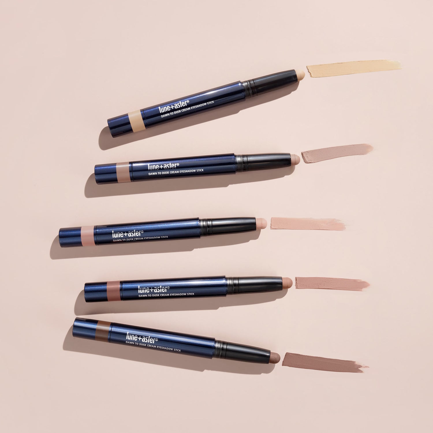 Lifestyle image of Lune+Aster Dawn to Dusk Cream Eyeshadow Stick variant: Shimmer Frosted Blush