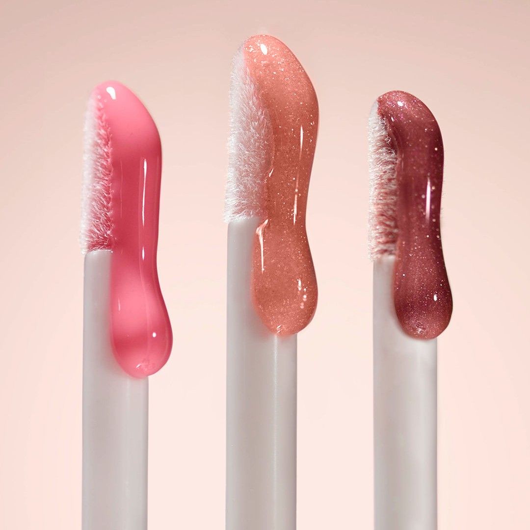 Lifestyle image of Lune+Aster Vitamin C+E Lip Gloss variant: Pomegranate